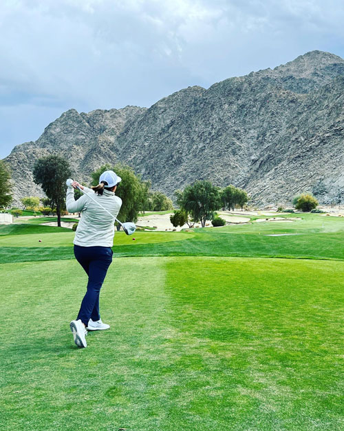 A woman playing gold At Silver Rock Resort in La Quinta, CA